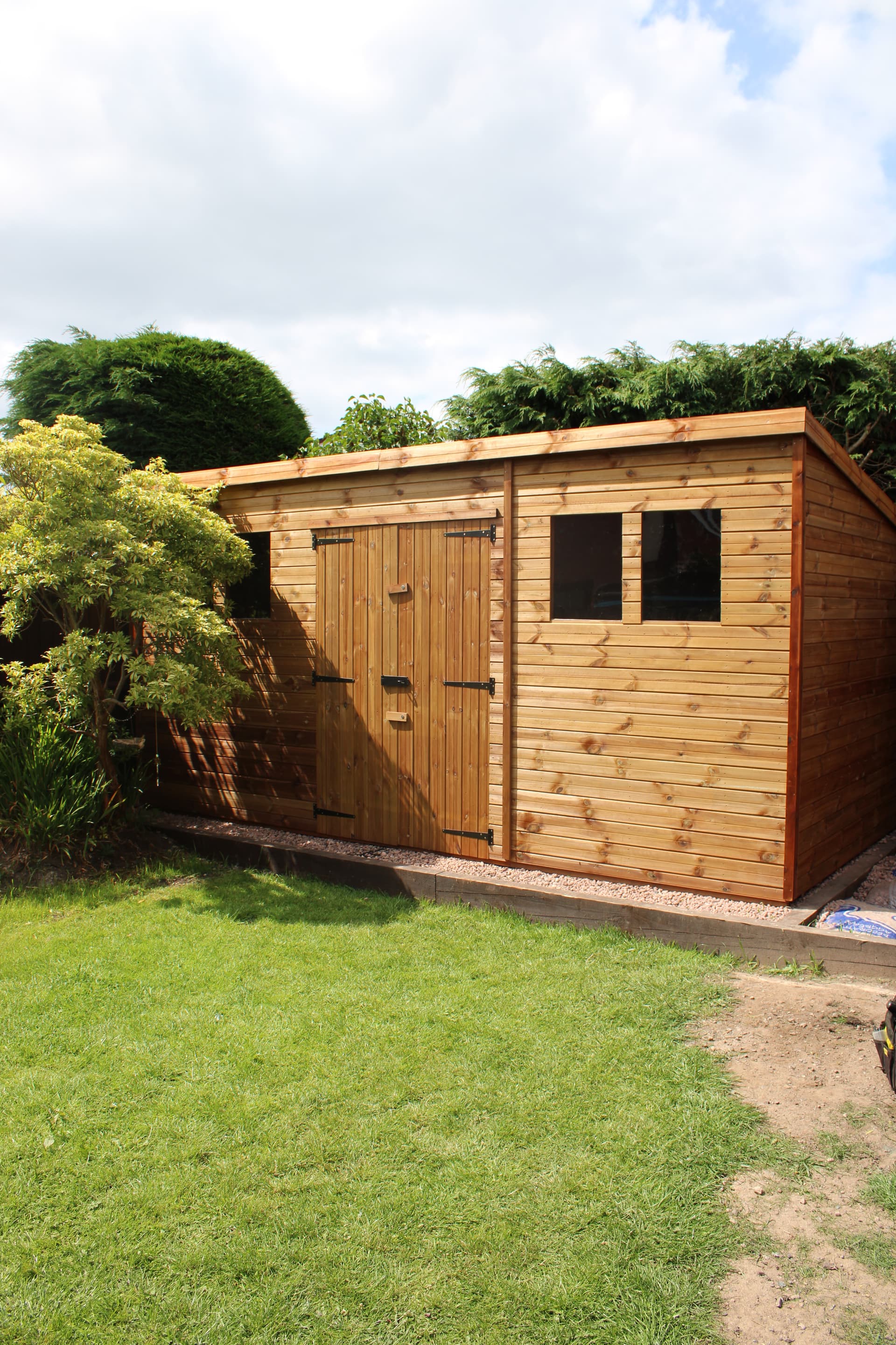 Bespoke tanalised pent roof garden shed with double doors installed in Birmingham